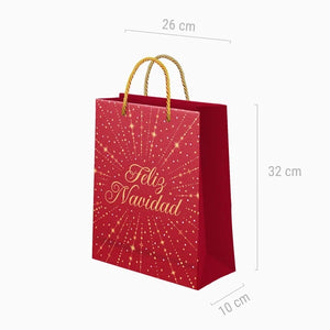 Bolsa de regalo mediana de Navidad roja con mensaje Feliz Navidad dorado, asas trenzadas y medidas de 26 × 10 × 32 cm.