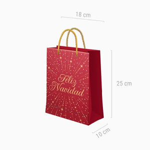 Bolsa de regalo pequeña Feliz Navidad roja con estrellas doradas y asas de cordón, medidas de 18 × 10 × 25 cm.